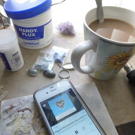 cup-of-coffee-with-iphone-on-workbench