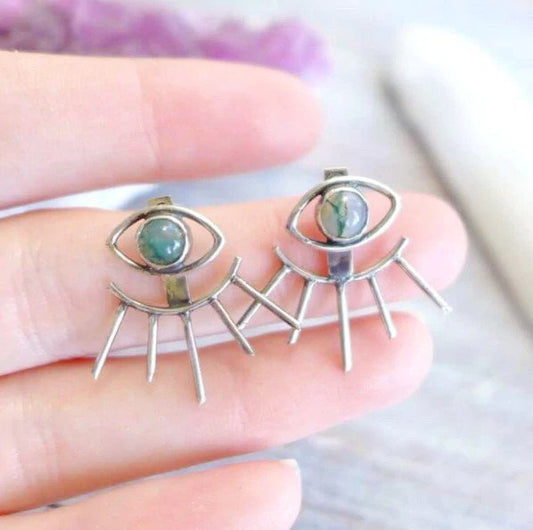 Evil eye earrings.