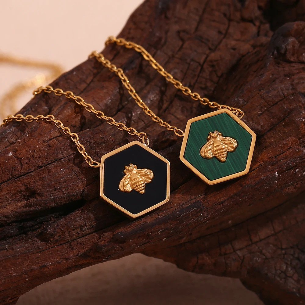 Closeup of the Bee Hexagon Gold Necklace.