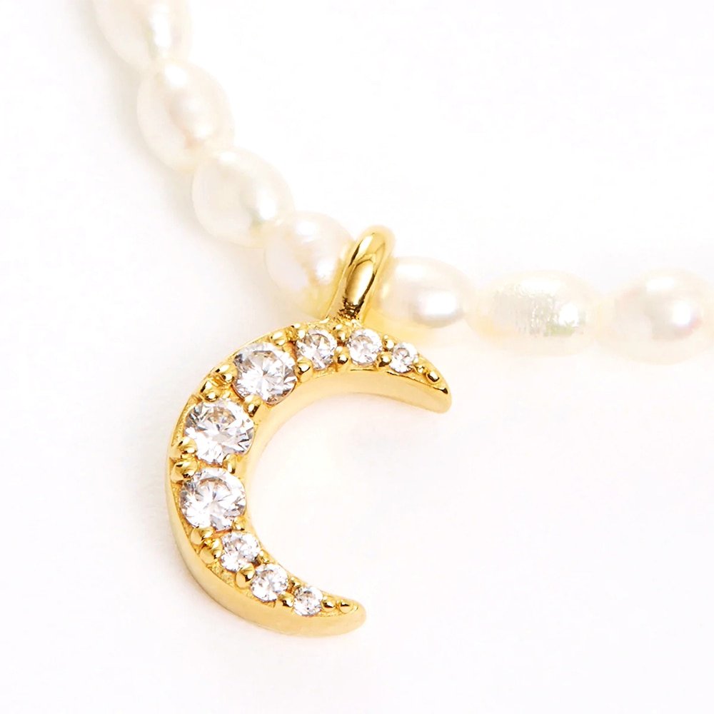 Closeup nof the Moon Pearl Charm Gold Necklace.