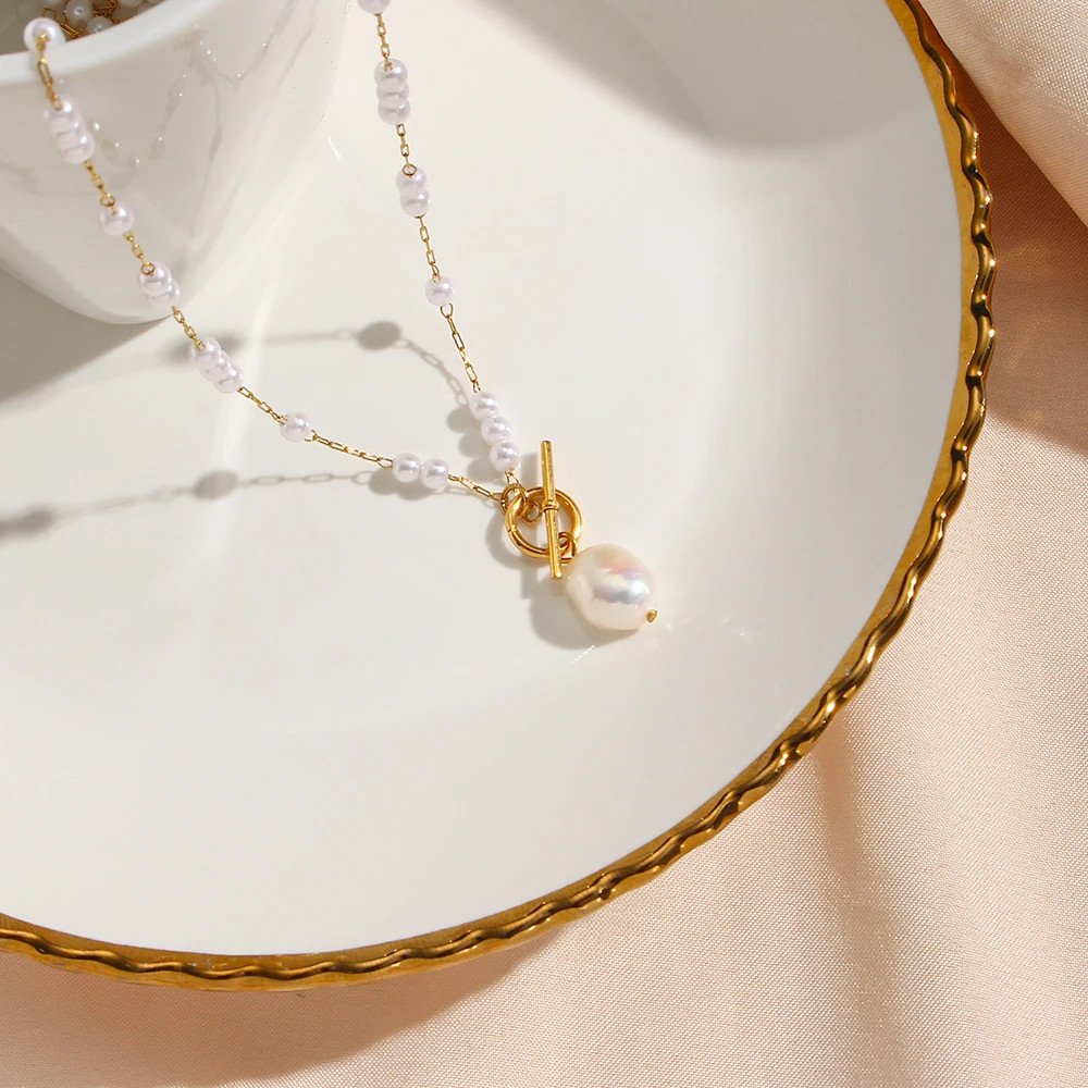 Closeup of the Pearl Drop Gold Necklace.