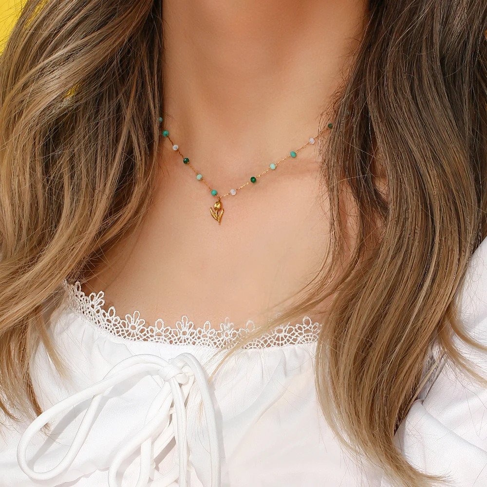 A model wearing the Tulip Beaded Gold Necklace.