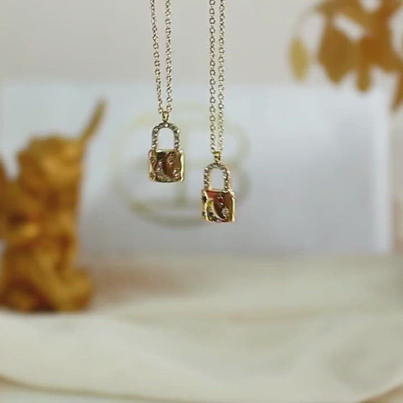 Video showcasing the Rainbow Moon Padlock Necklace.