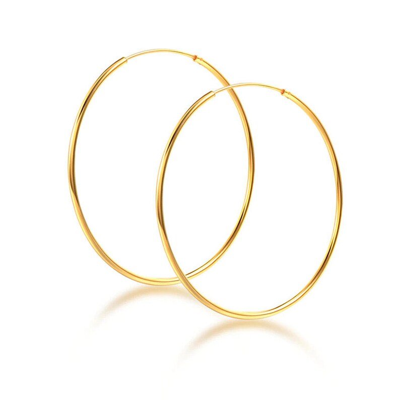 Large gold hoop earrings.