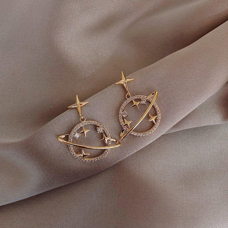 Gold star planet Saturn Earrings.