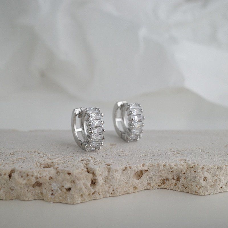 Closeup of the silver CZ Baguette Huggies.