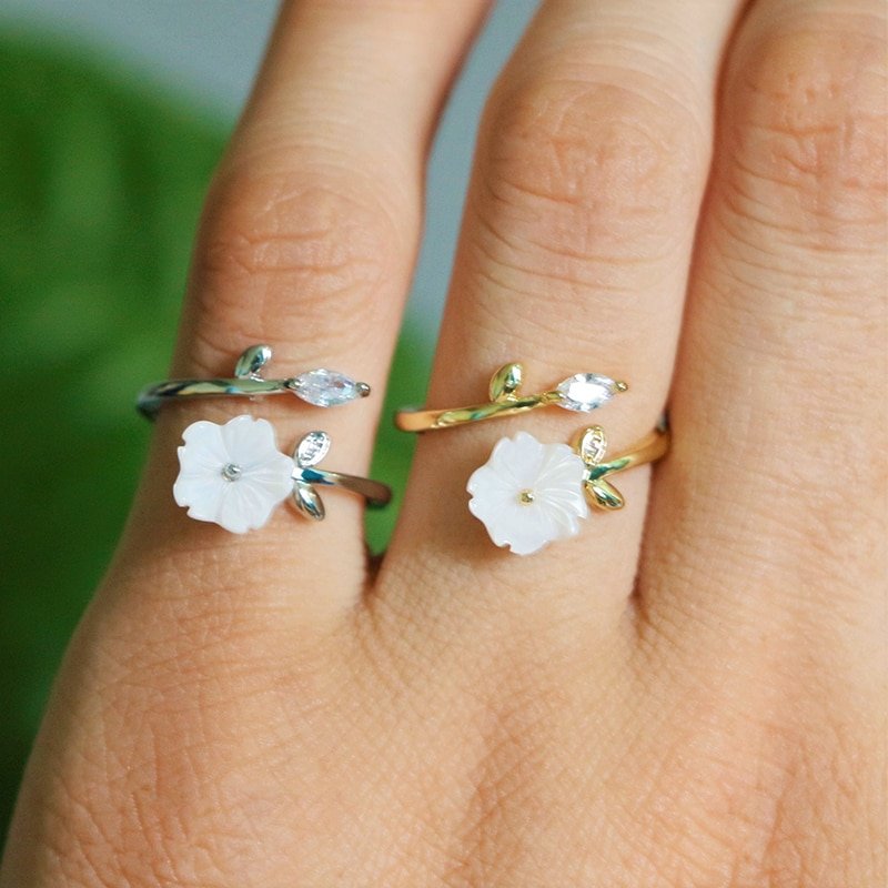 A model wearing a gold and silver Flower Branch Ring.