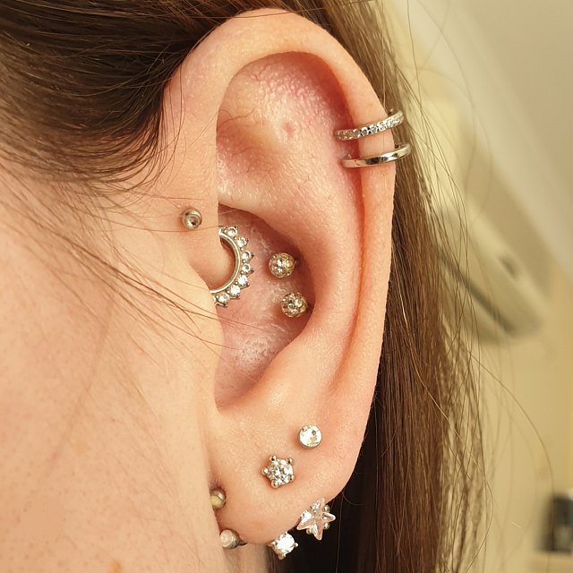 A woman wearing the silver Gina Ear Cuff Set.