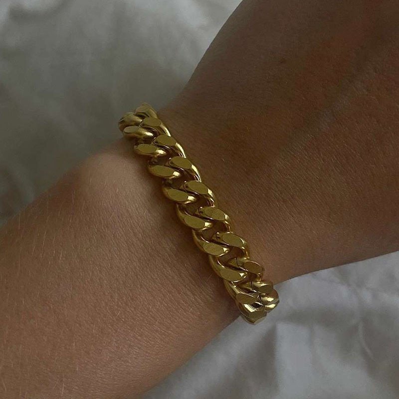 A model wearing the 8mm Gold Cuban Link Bracelet.