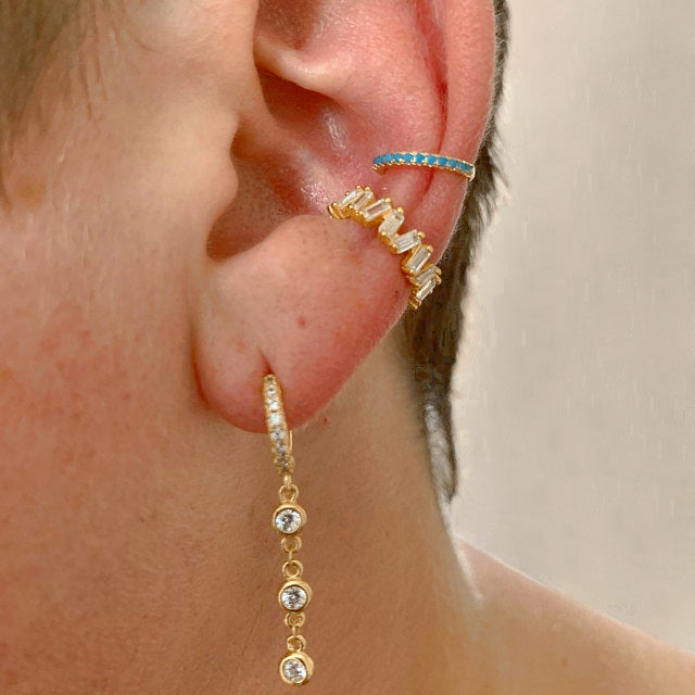 A model wearing a gold Icy Ear Cuff.