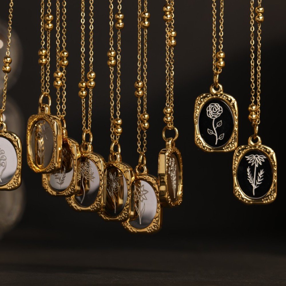 Twelve Mirrored Birth Flower Gold Necklaces.