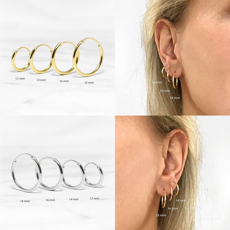 Multiple sizes of gold and silver hoop earrings.