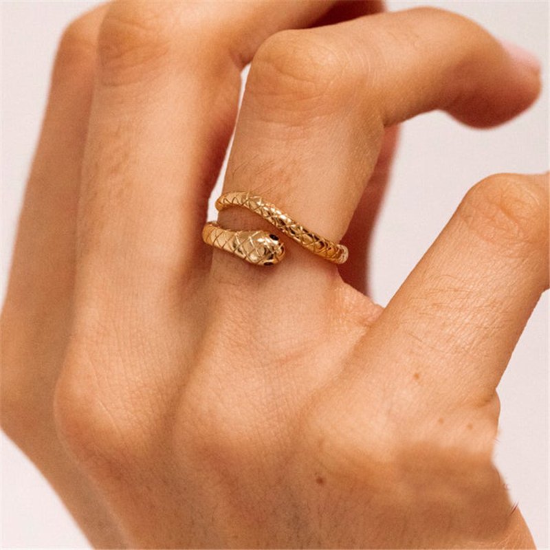 A model wearing a gold Snake Wrap Ring.