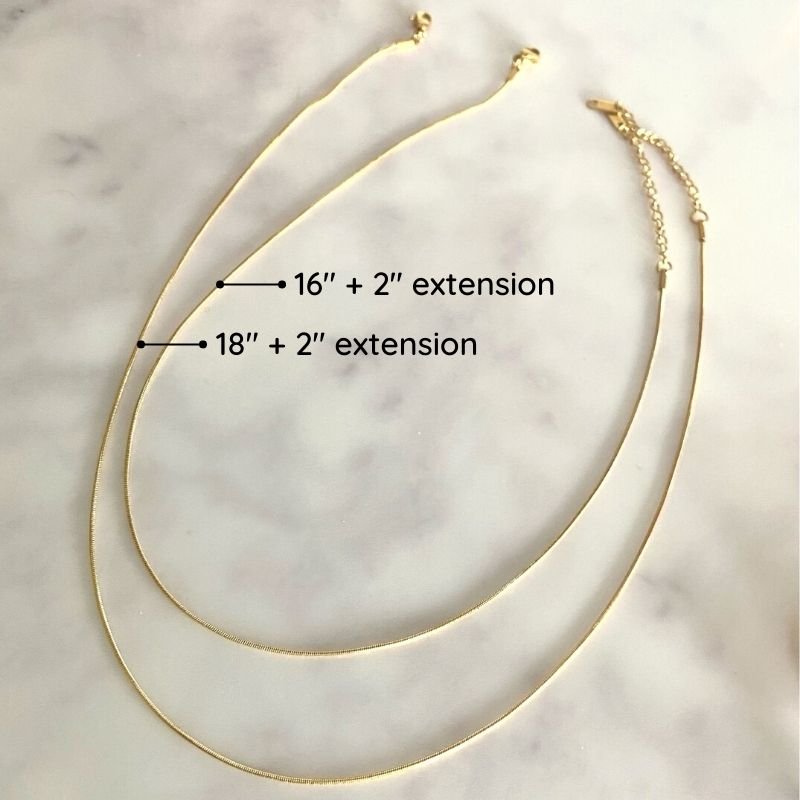 Thin gold necklaces in two lengths.