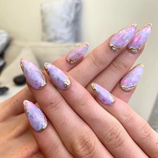 Opal with gold edge nails.