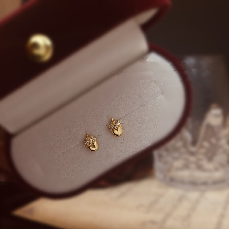 Tiny acorn stud earrings.