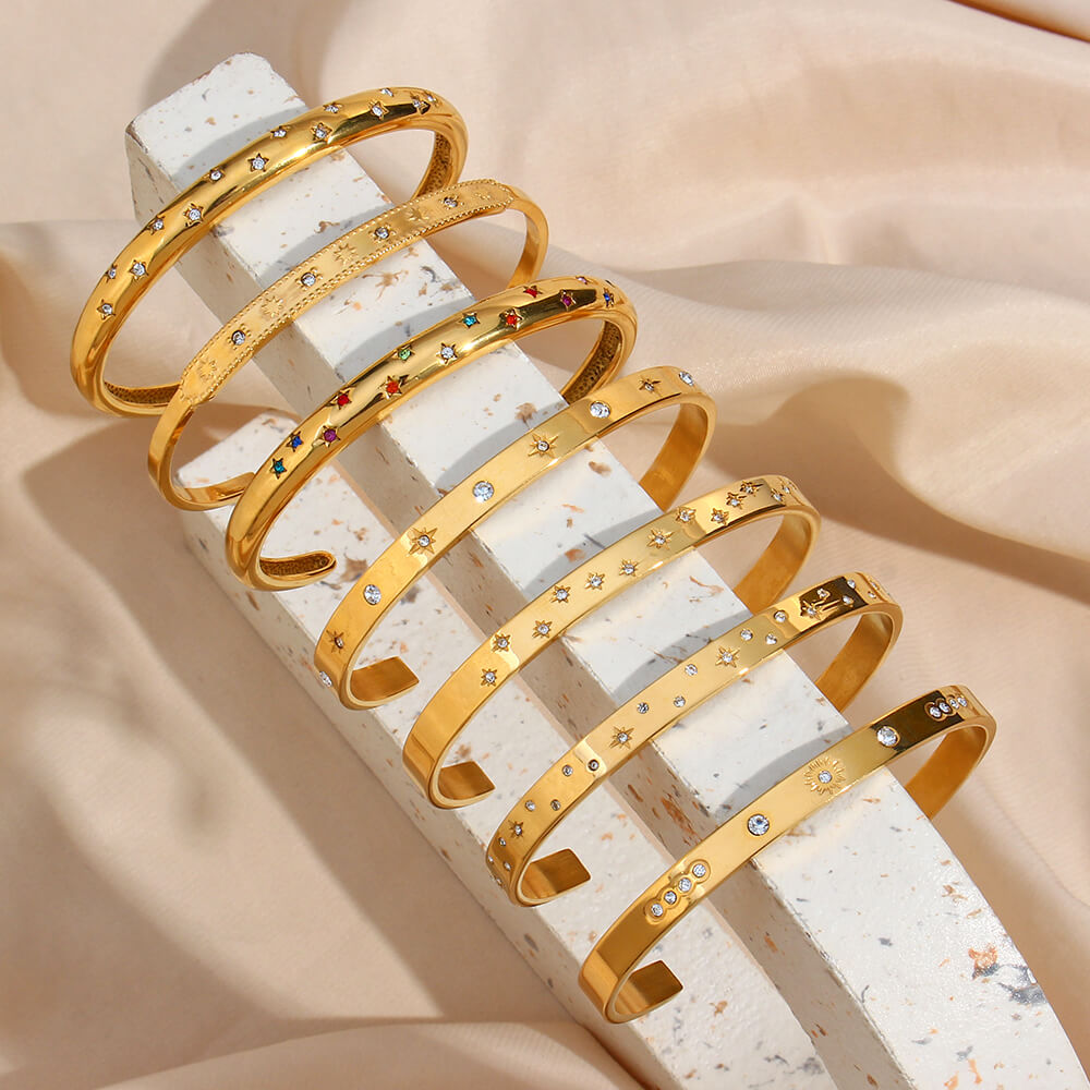 Closeup of the Celestial Gold Stacking Bracelets.