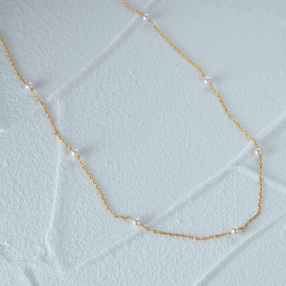 Closeup of the Delicate Pearl Chain Necklace.