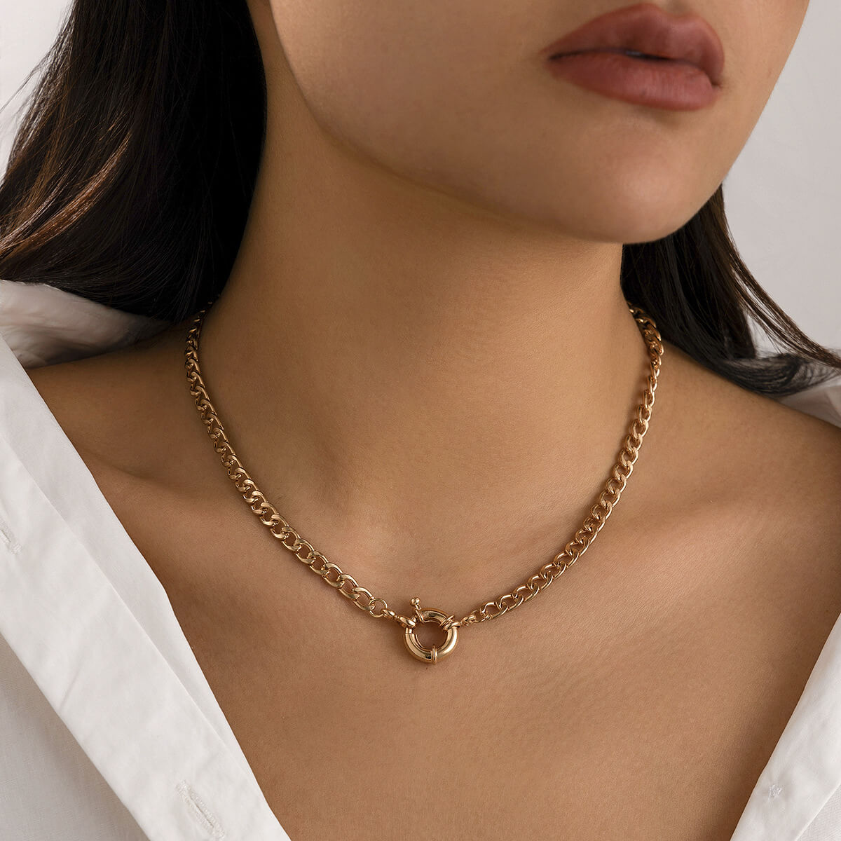 A model wearing a Front Clasp Gold Curb Chain Necklace.