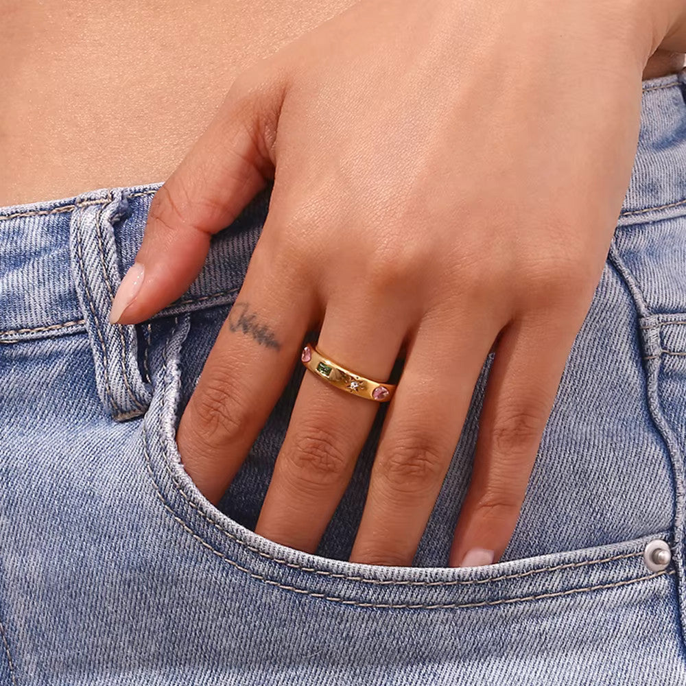 A woman wearing the gold Gemstone Cluster Ring.