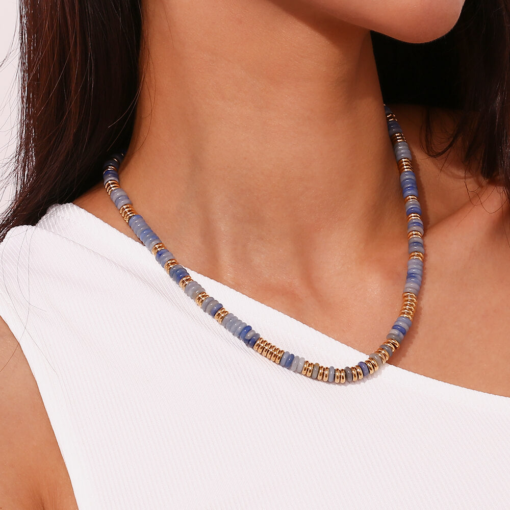 A model wearing a sodalite Gemstone Rondelle Beaded Gold Necklace.