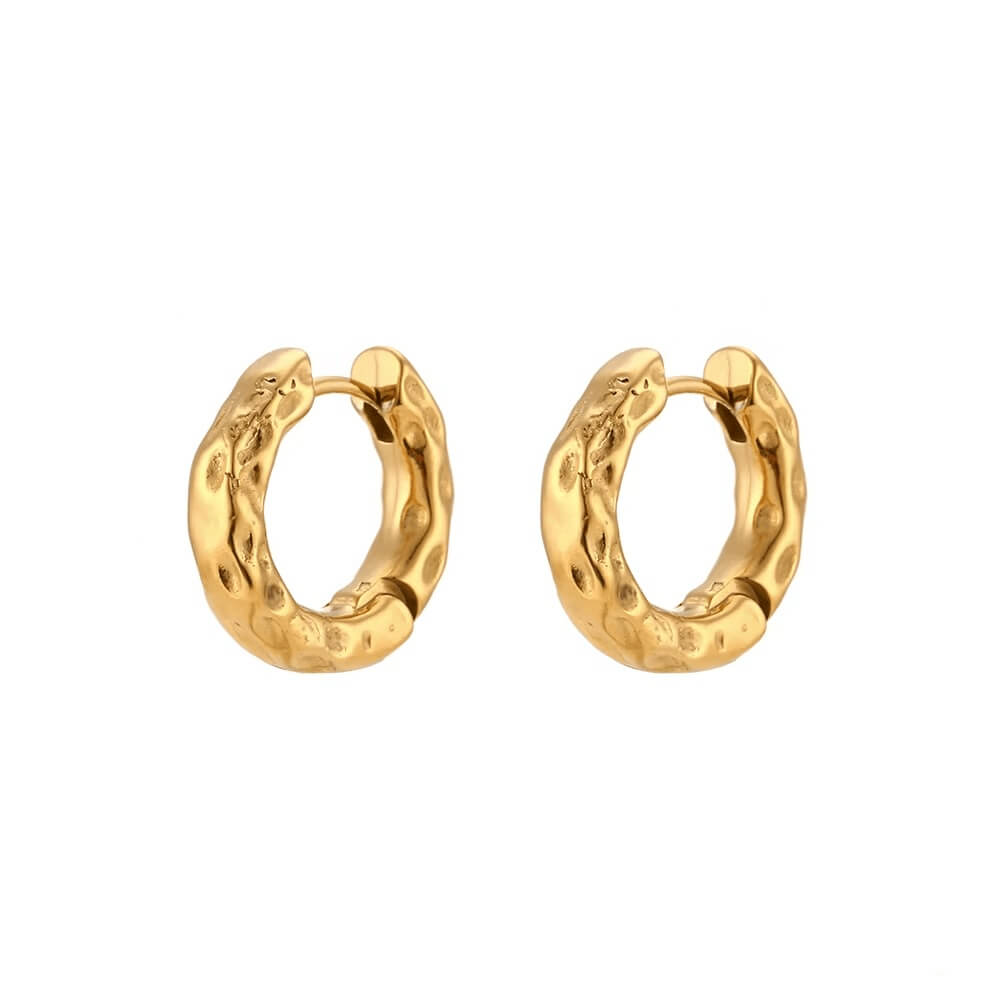 Gold hoop earrings on a white background