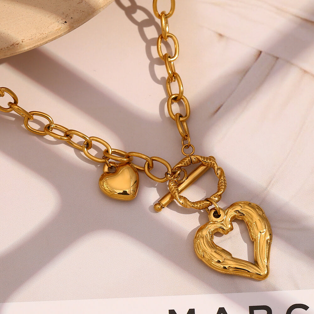 Gold heart charm front toggle clasp necklace.