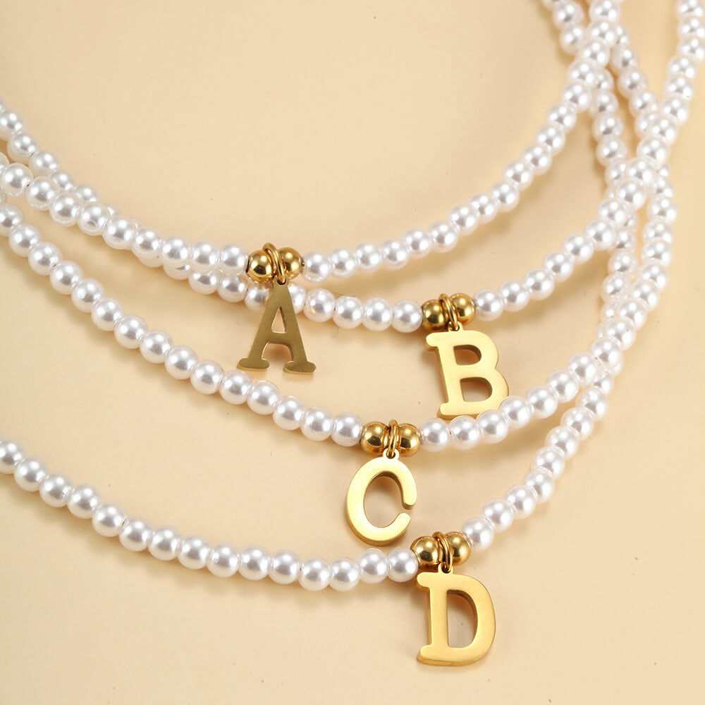 Closeup of the Pearl Initial Gold Necklace.