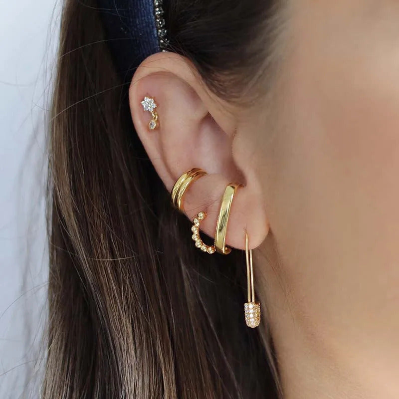 A model wearing the Safety Pin CZ Earrings.