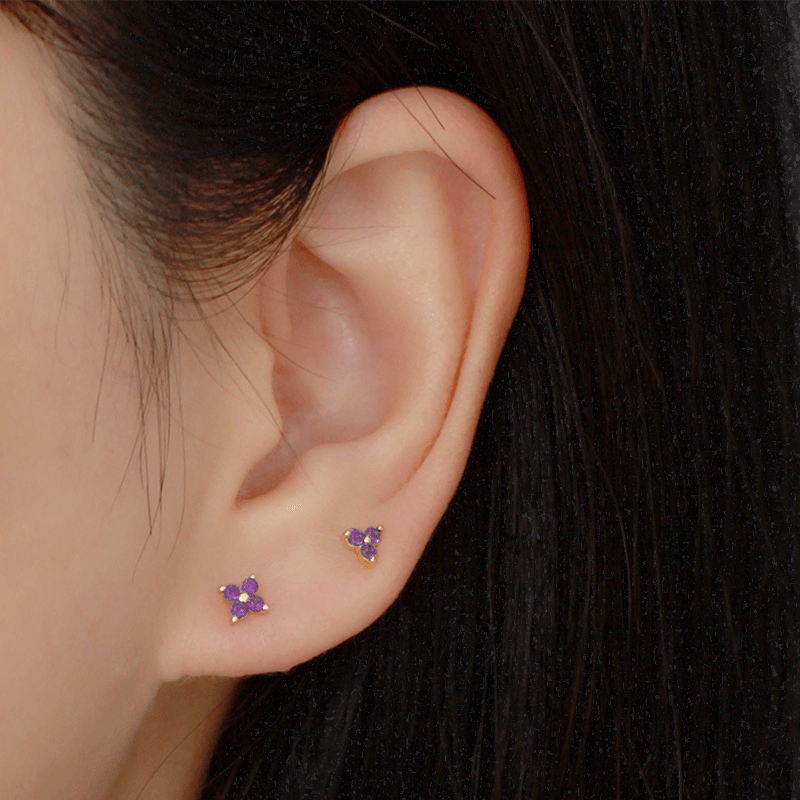 A model wearing the Lilac CZ Flower Studs.