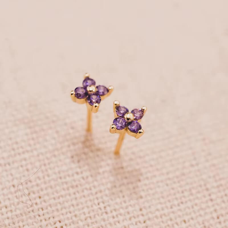 Purple CZ stud earrings.