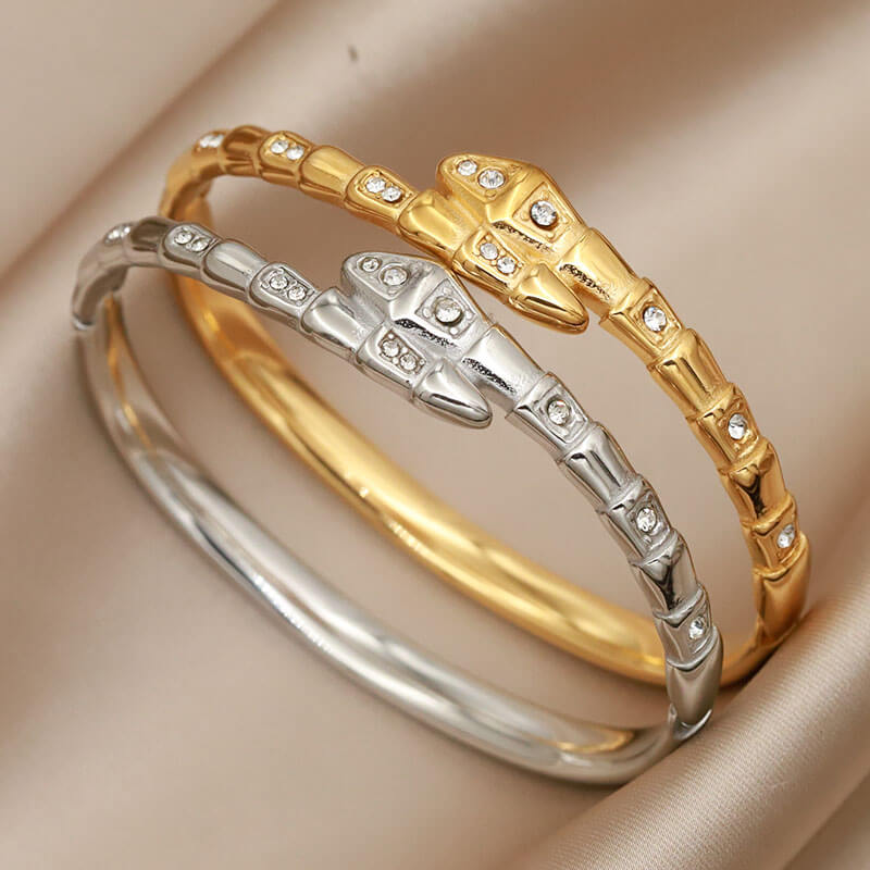 Gold and silver cz snake bangles.