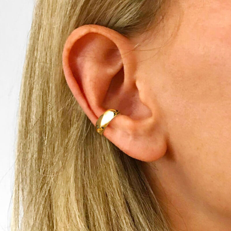 A model wearing the Thick Ear Cuff.