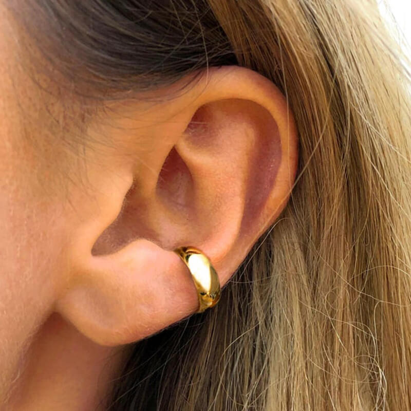 A woman wearing the Thick Ear Cuff.