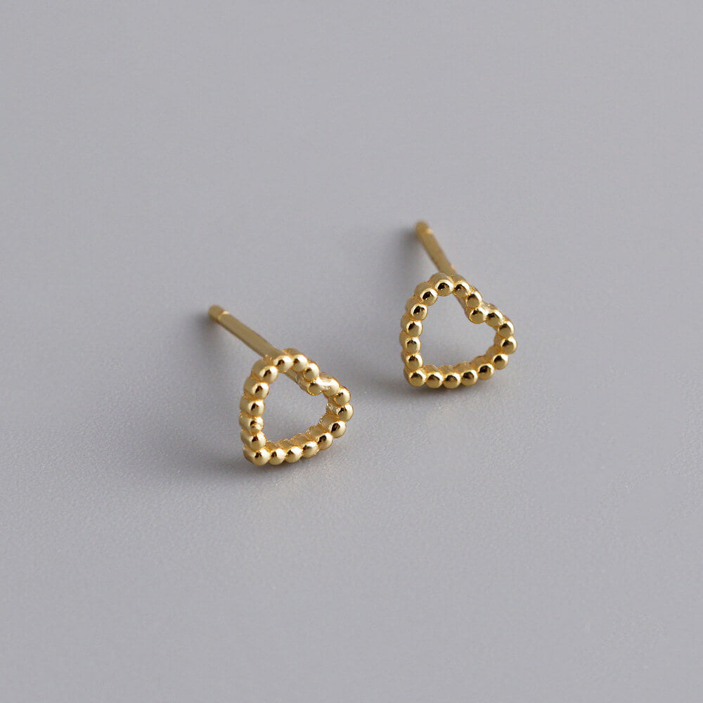 Closeup of the gold Beaded Heart Studs.