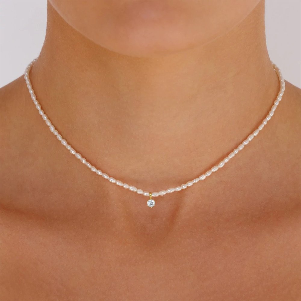 A model wearing the CZ Pearl Charm Gold Necklace.