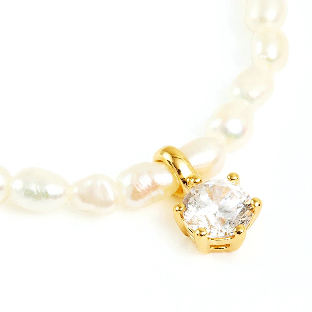 Closeup of the CZ Pearl Charm Gold Necklace.