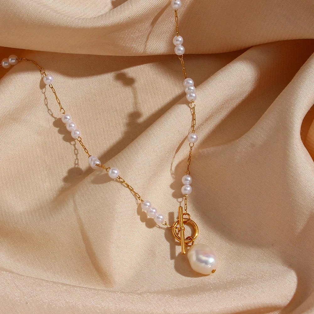 Pearl beaded gold toggle necklace.