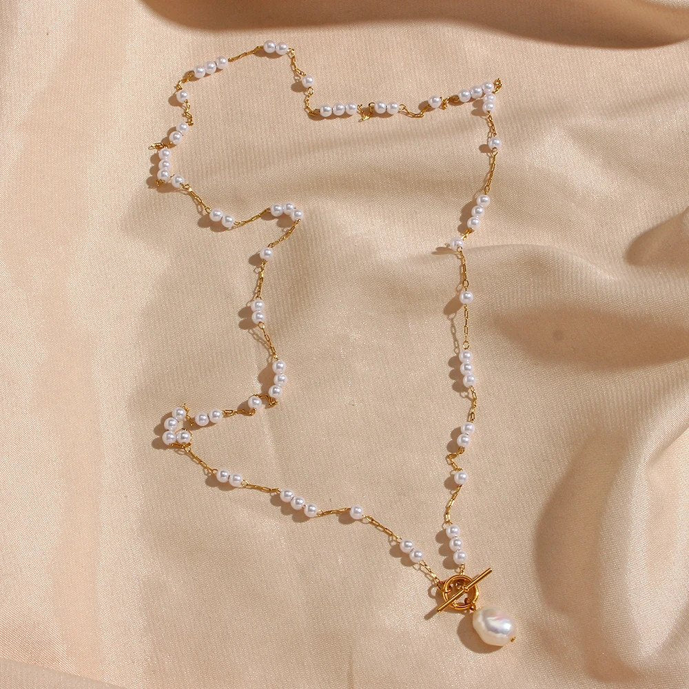 Full view of the Pearl Drop Gold Necklace.