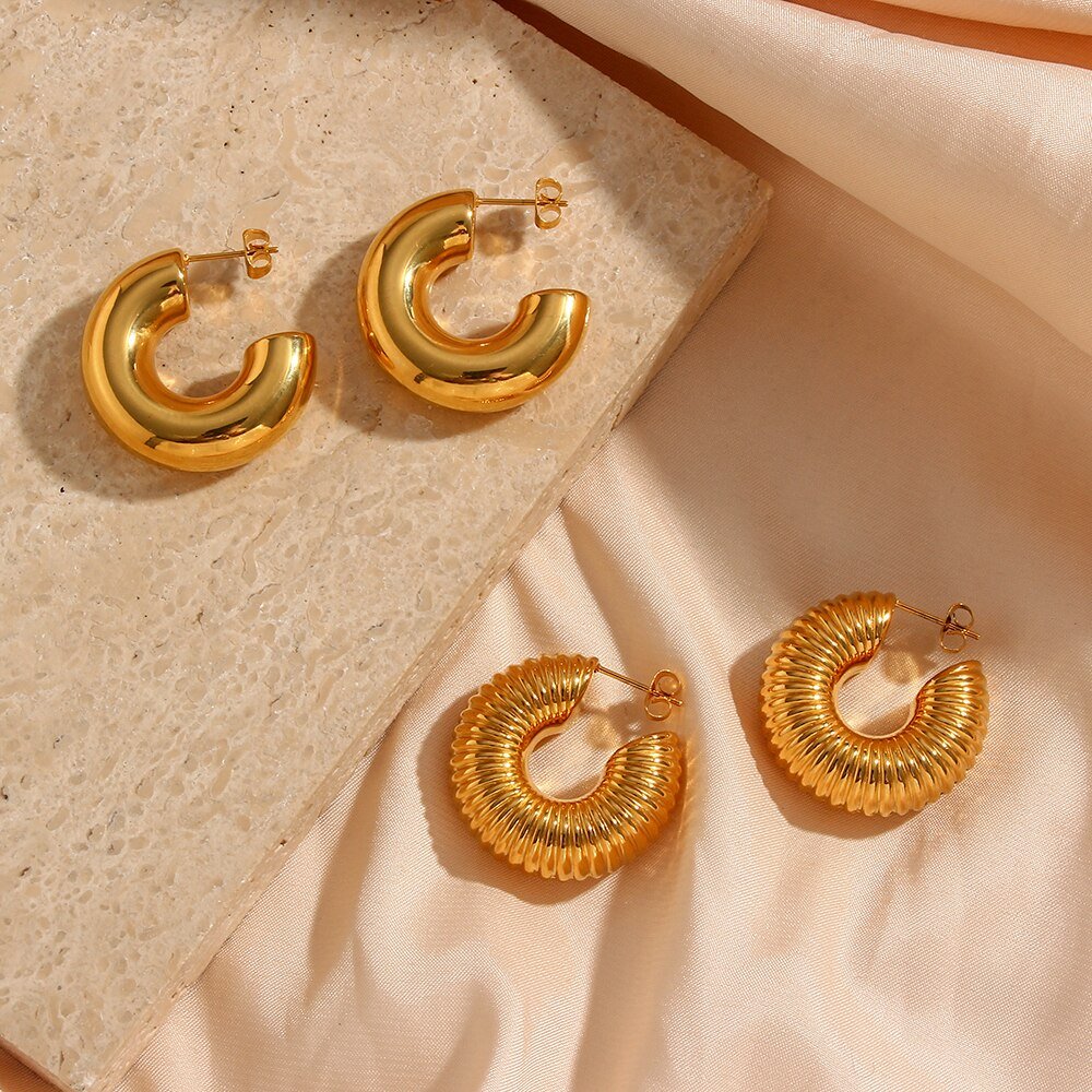 Chunky gold hoop earrings.