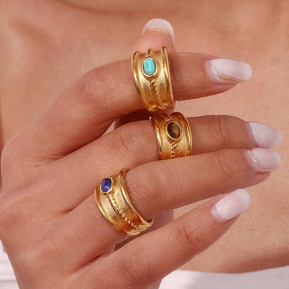 A woman wearing western style gemstone rings.