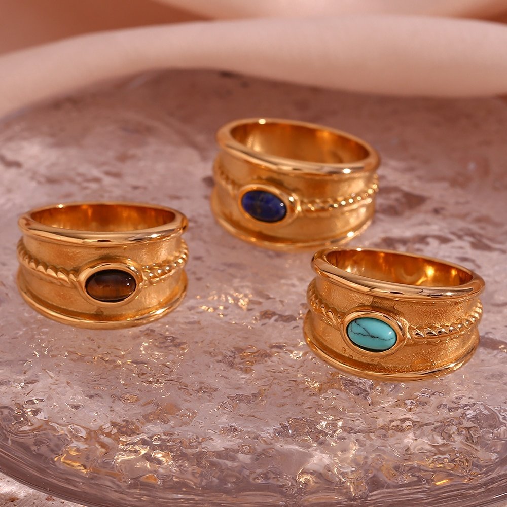 Chunky gold gemstone rings.