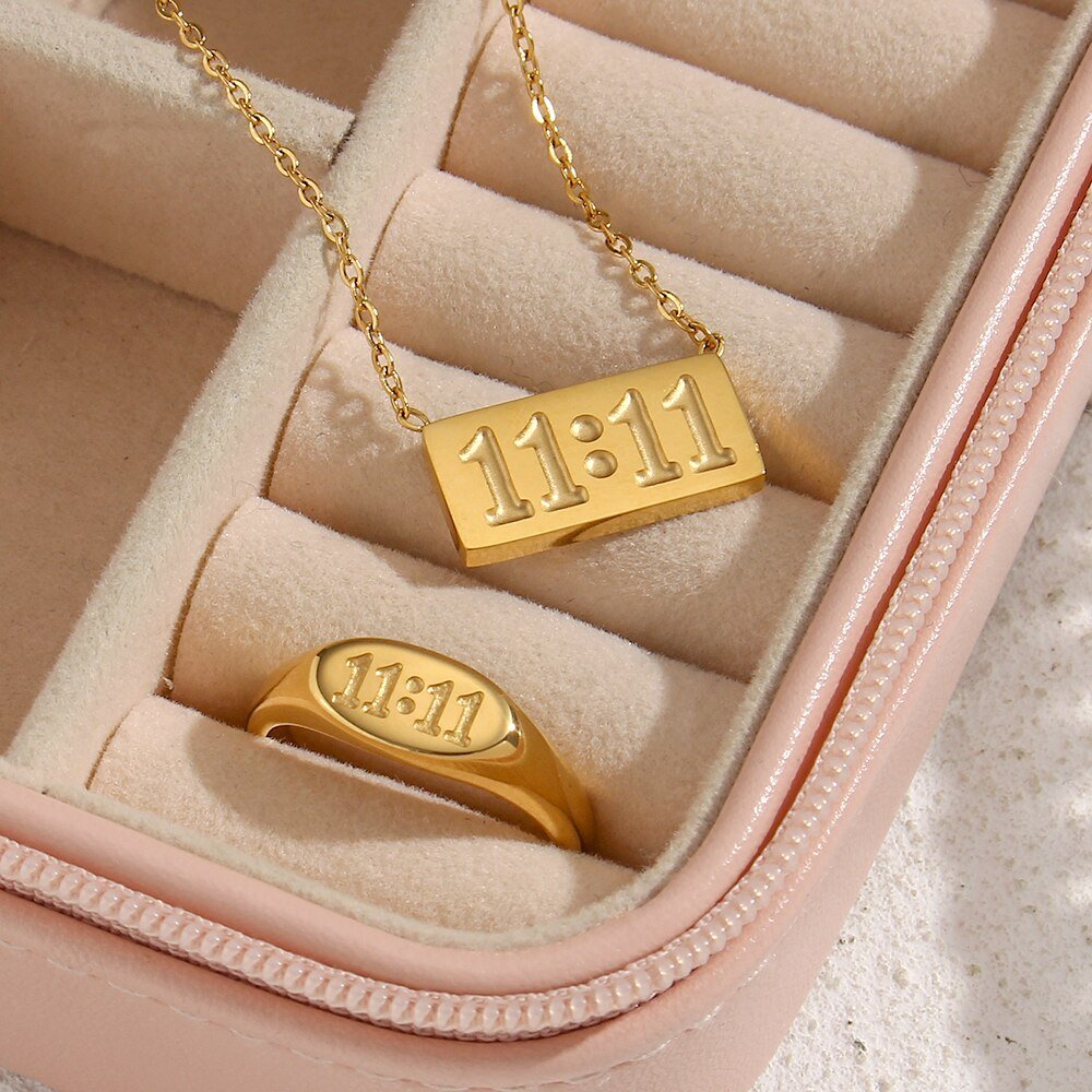 Gold 11:11 ring and necklace set.