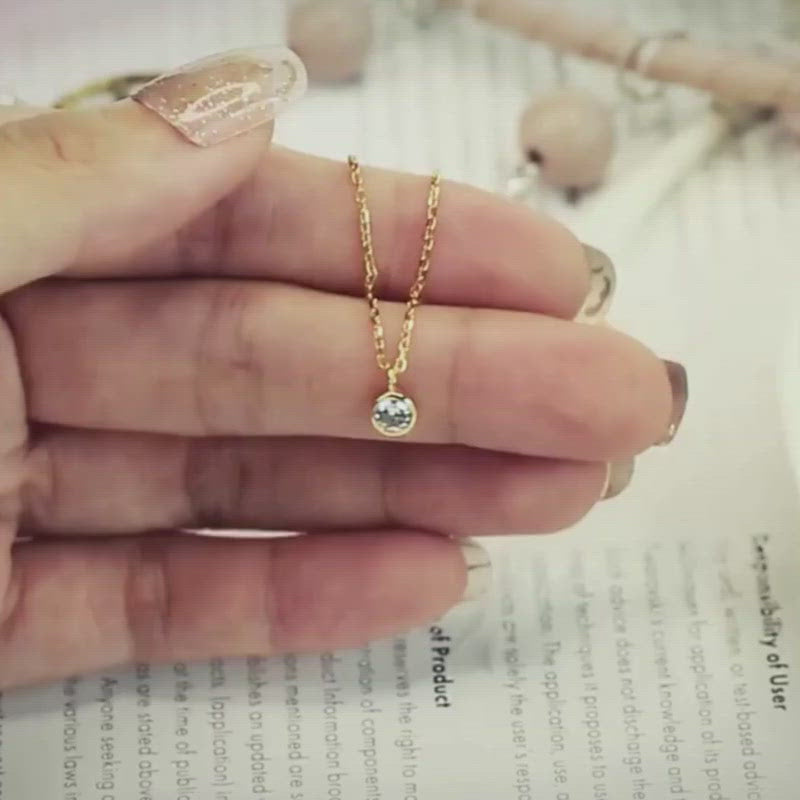 A video showing the Short Gold CZ Necklace.
