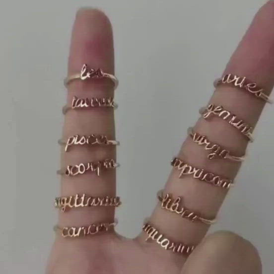 A video showing the Zodiac Name Rings in Gold.