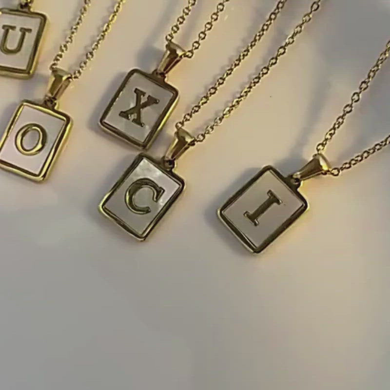 A video showing the Mother of Pearl Monogram Necklace.