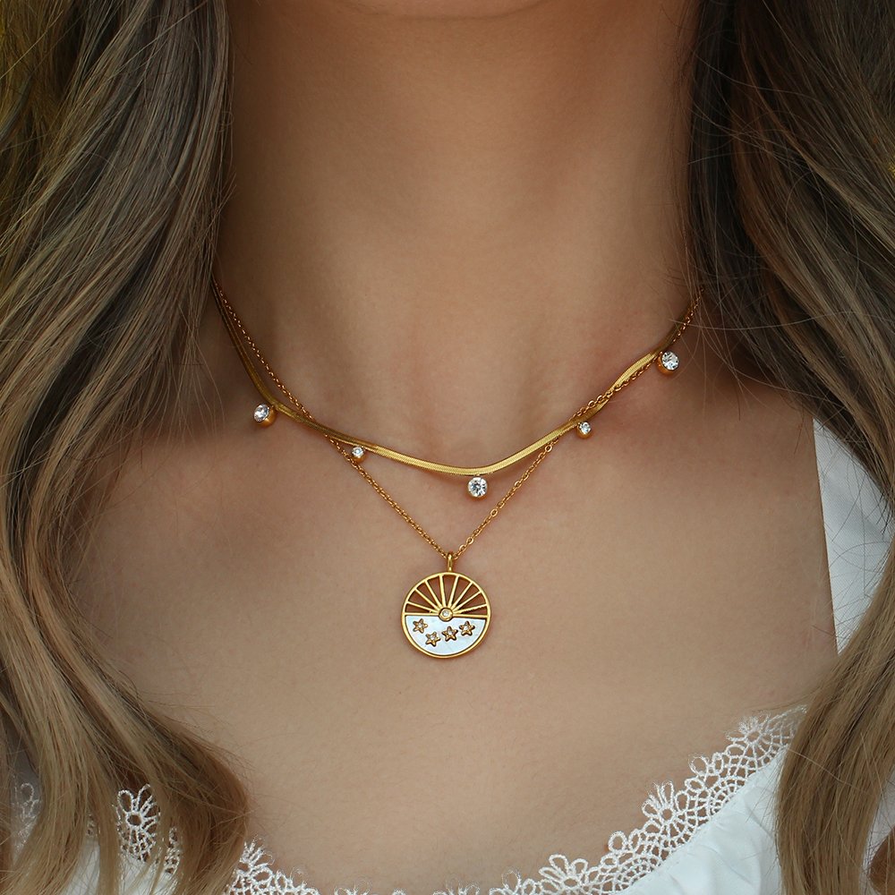 A model wearing the Andromeda Gold Necklace.