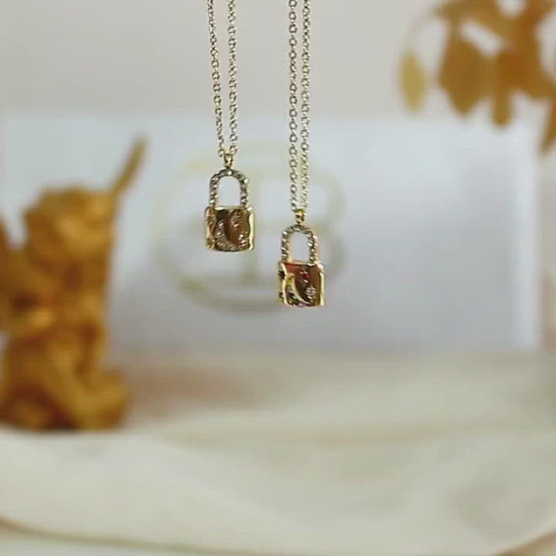 Video showcasing the Celestial Moon Padlock Necklace.