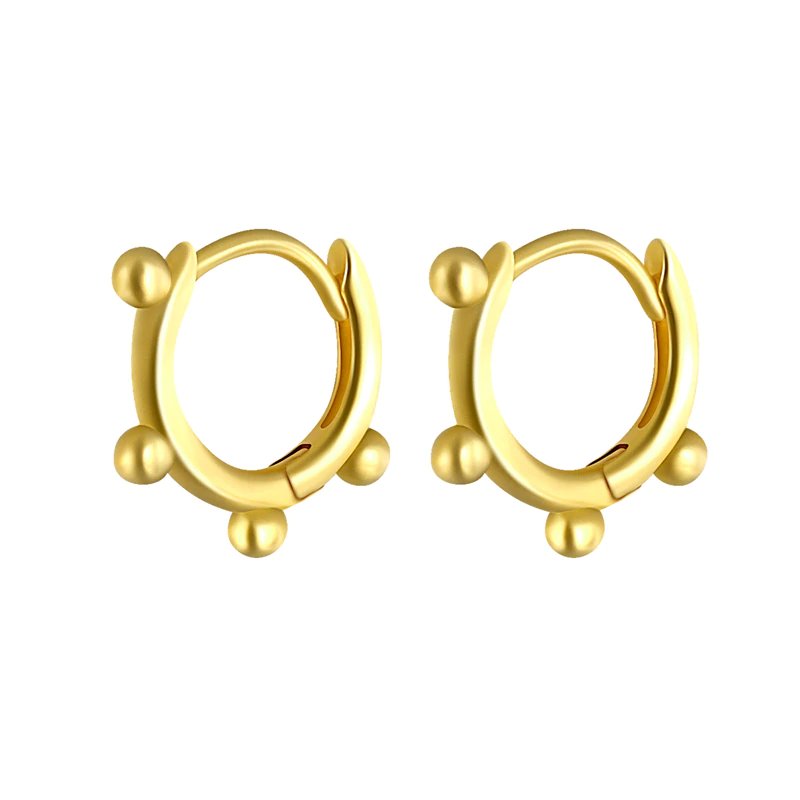Mini gold hoop earrings with four little balls along the hoop.