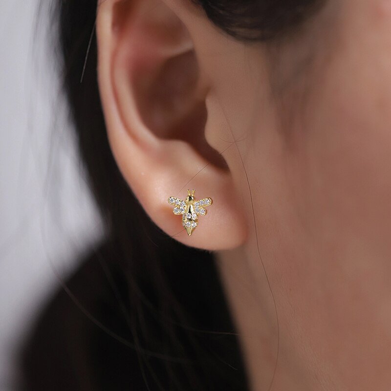 A model wearing the Bee CZ Studs.